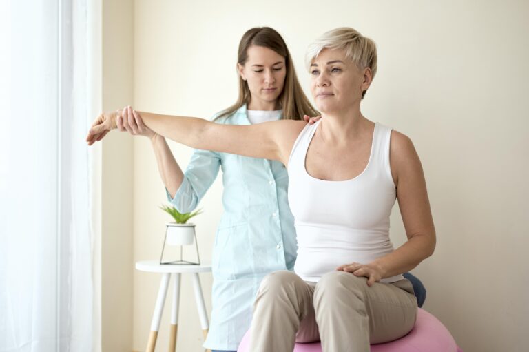 female patient undergoing therapy with physiotherapist